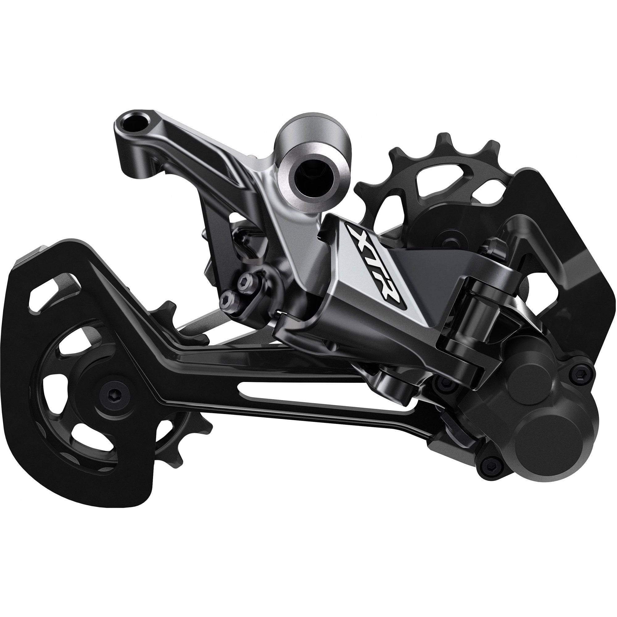 Shimano XTR RD-M9100 12-speed MTB rear derailleur with Shadow Plus design, mounted on a mountain bike drivetrain.