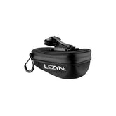 Lezyne Pod Caddy M QR saddle bag in black with reflective piping, quick-release bike storage accessory mounted on bike saddle