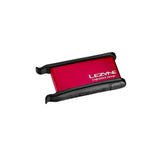 Lezyne workshop puncture repair kit with lever patches, tyre boot, and scuffer for bike tire repairs.