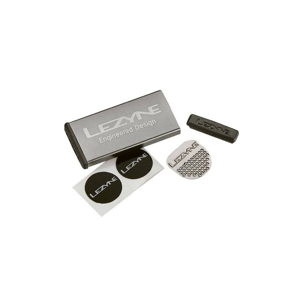 Lezyne Metal Patch Kit with waterproof aluminium case for quick tyre repairs, shown with patches and tools inside.