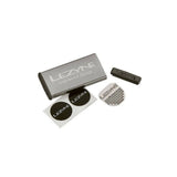Lezyne Metal Patch Kit with waterproof aluminium case for quick tyre repairs, shown with patches and tools inside.