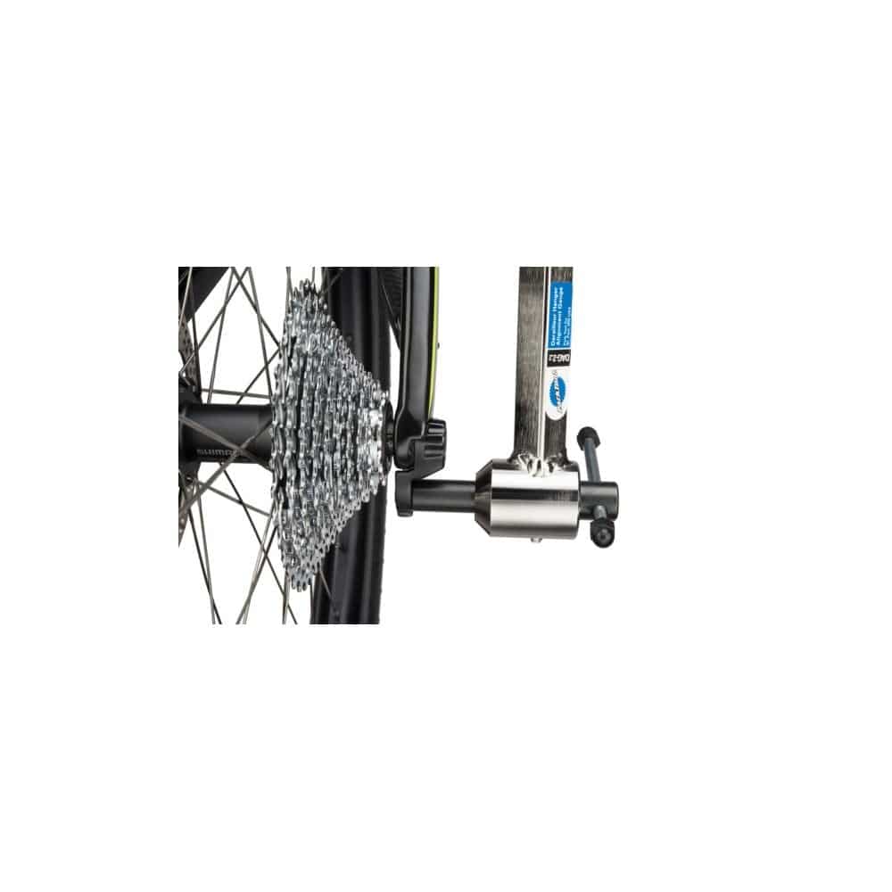 Park Tool DAG-2.2 derailleur hanger alignment gauge for precise bike derailleur adjustments in workshop setting.