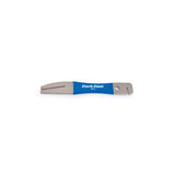 Park Tool DT-2 rotor truing fork for precise disc brake rotor adjustment, shown in a workshop setting with tools and bike components.