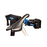 Park Tool PRS-25 Team Issue bike repair stand with adjustable clamp, used for professional bike maintenance and workshop setups.