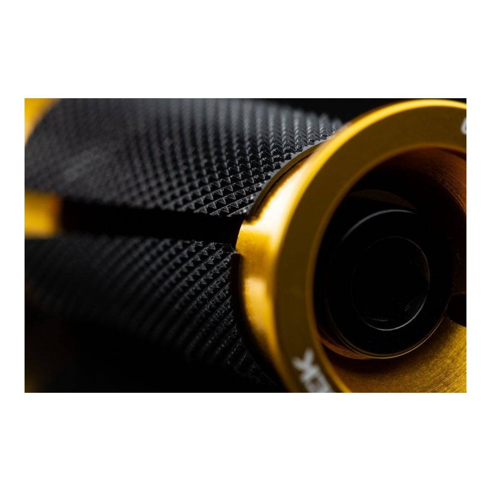 Cane Creek Ancora expander plug for carbon steerer tubes in black and gold, component for bike steering systems.
