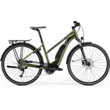 Merida eSpresso 300SE EQ women's hybrid e-bike with Shimano STEPS motor and 418Wh battery, shown outdoors with sleek design.