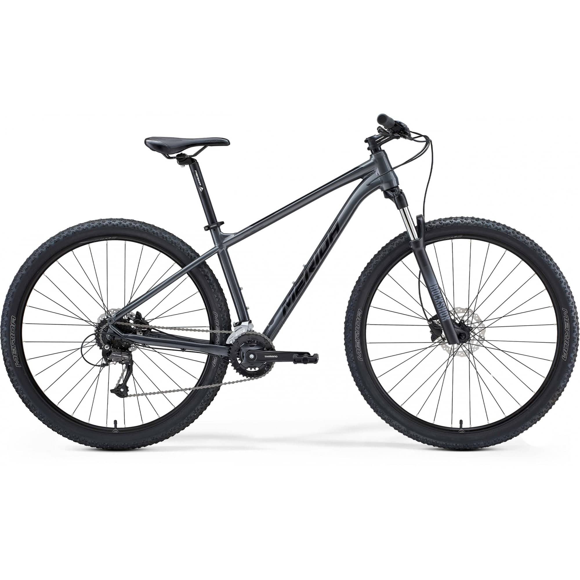 Merida Big Nine 60 mountain bike with Shimano Altus gears and internal cable routing, featuring a sturdy frame and off-road tires.