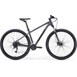 Merida Big Nine 60 mountain bike with Shimano Altus gears and internal cable routing, featuring a sturdy frame and off-road tires.