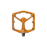 Crank Brothers Stamp 7 flat mountain bike pedal with adjustable pins, black metal body and rugged design for mountain biking.