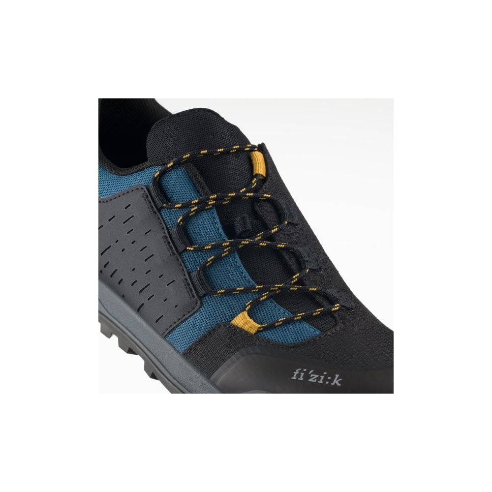 Fizik X2 Terra Ergolace MTB shoes with Vibram outsole designed for trail and mountain biking, showcasing durable footwear.