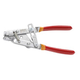 Red UNIOR cable puller pliers with lock, used for brake and derailleur cables in bike workshop setups.