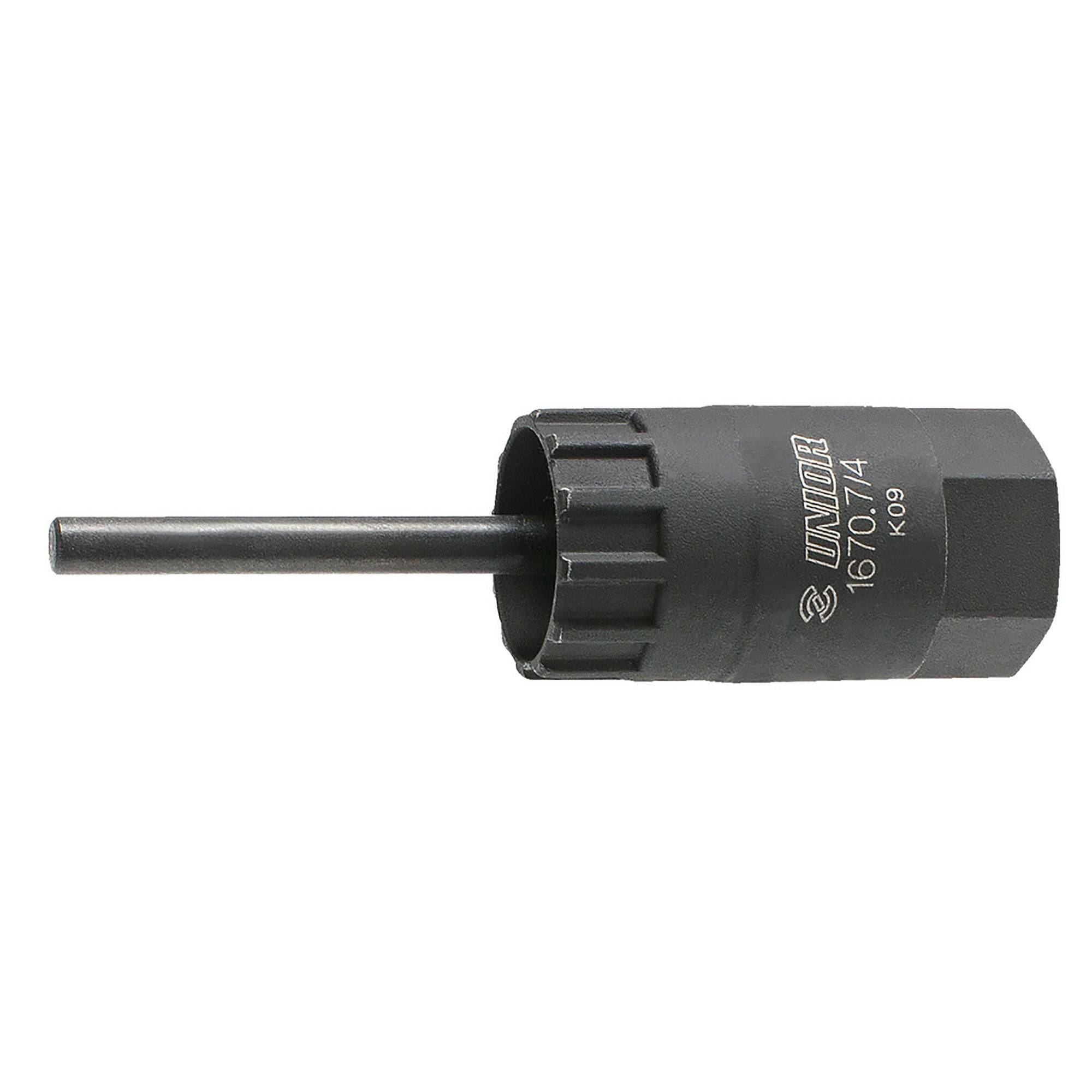 UNIOR cassette lockring tool with guide for precise installation and removal, used in bike workshop maintenance.