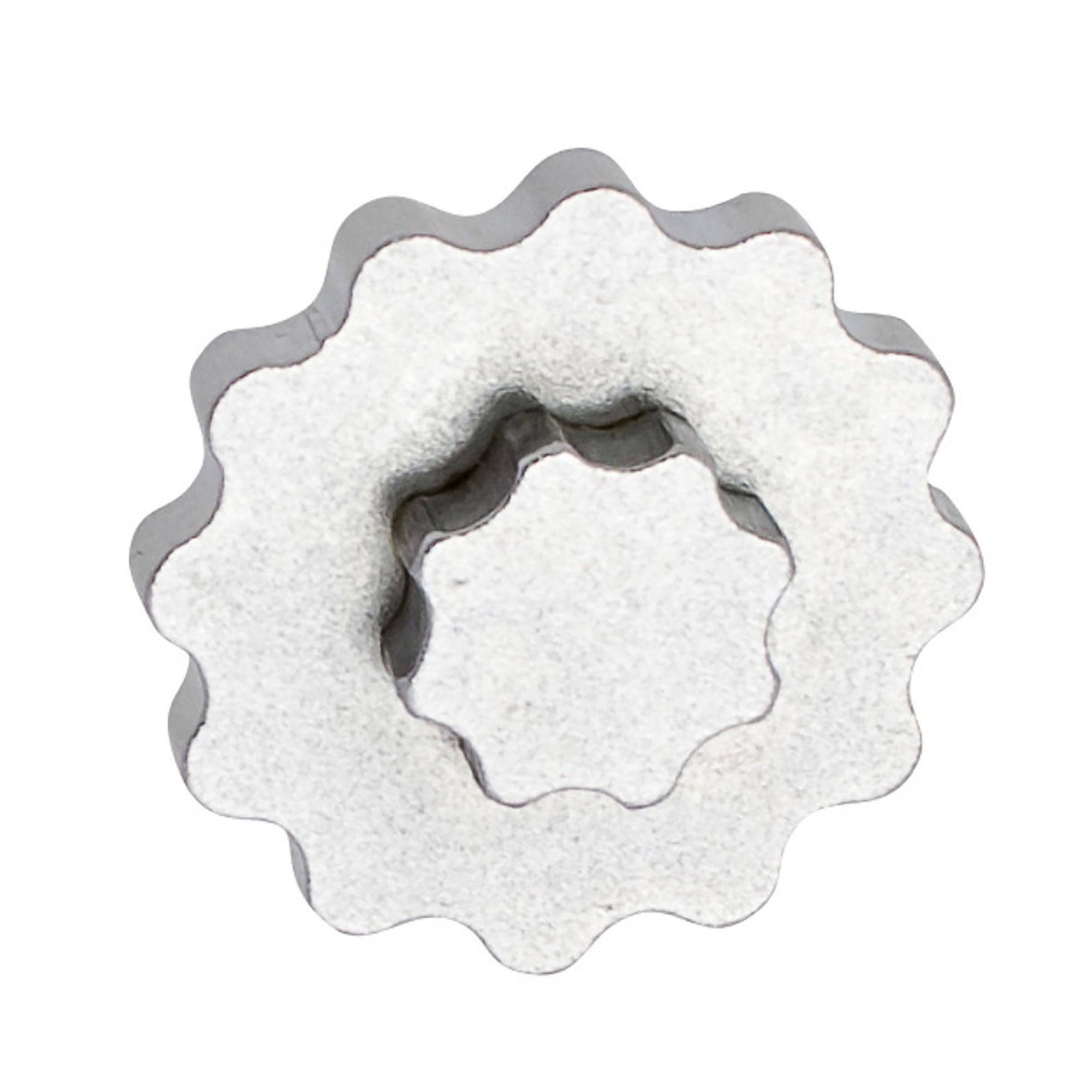 UNIOR metal crank cap tool for Shimano Hollowtech II with magnetic storage, used in bike workshops for crank arm maintenance.