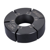 UNIOR flat spoke holder for bicycle wheel spoke handling and repair in a workshop setting, showcasing precise spoke management tools.