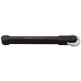 UNIOR Pro Chain Wear Indicator Tool for bike chain measurement, showing the tool with measurement markings in a workshop setting.