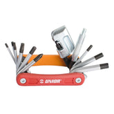 UNIOR Euro13 Multitool red compact bike repair workshop tool kit with various tools laid out on a workbench.
