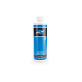 Park Tool Bio Chainbrite 4 bicycle chain degreaser in a workshop setting, eco-friendly bike chain cleaner.