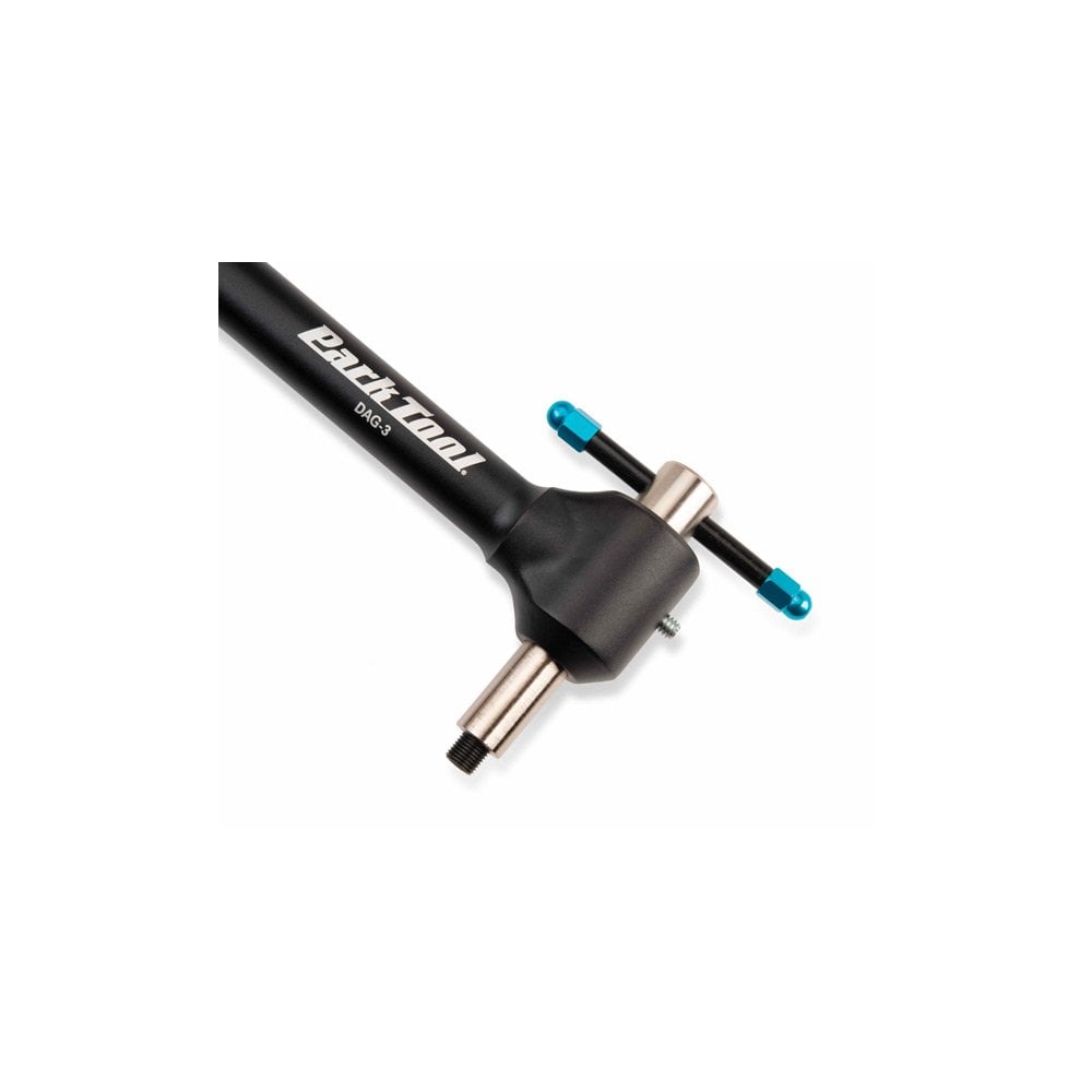 Park Tool DAG-3 derailleur hanger alignment gauge used in bike workshop for precise derailleur adjustments and repairs.