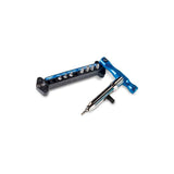 Park Tool QTH-1 quick change bit driver set with magnetic 1/4-inch bits for bike repair, shown with various bits in a workshop setting.