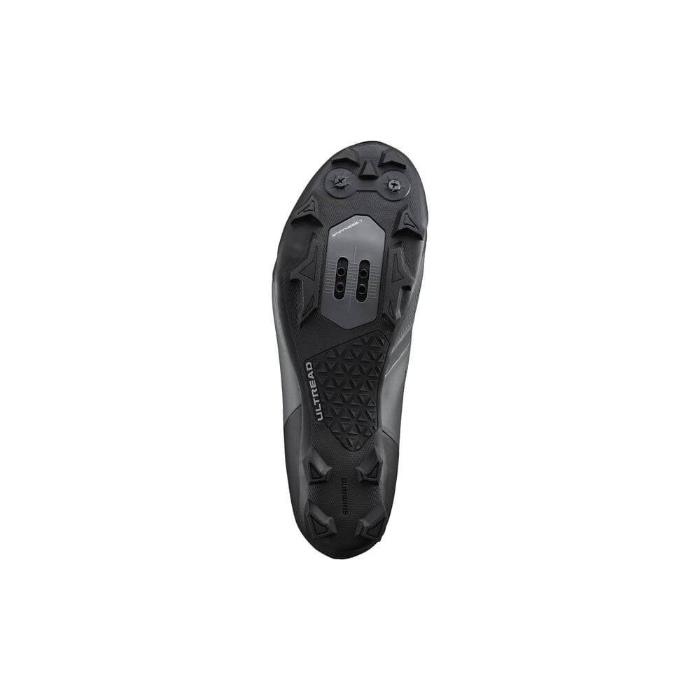 Shimano XC5W women's MTB shoes with SPD cleats, black cross-country mountain biking shoes for women, shown from side view.
