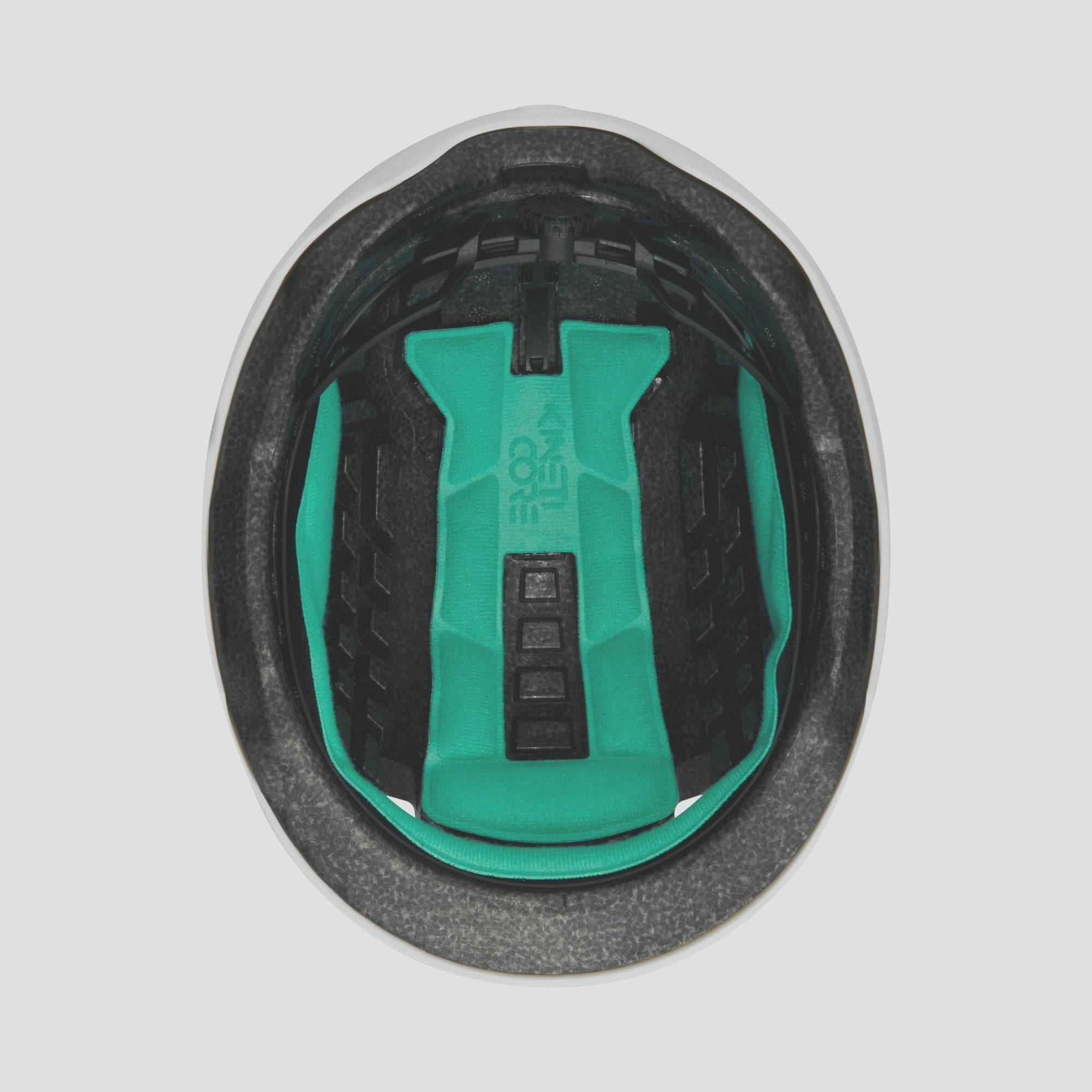 Lazer Cityzen KinetiCore urban cycling helmet with double-layer impact protection, shown in a city street setting.