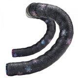 Supacaz Sticky Kush Galaxy cycling handlebar tape with high grip and shock absorption, shown wrapped around bike handlebars.