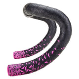Supacaz Sticky Kush Star Fade bike handlebar tape with high grip and shock-absorbing features, shown wrapped around handlebars.