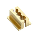 RockShox Vise Block 3-hole rear shock tool for Monarch Vivid and Vivid Air mountain bike shocks, in gold color.