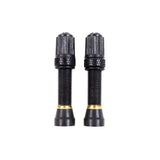 Nutrak threaded bronze Schrader tubeless valve pair for wider rims, bicycle components for secure tire inflation.