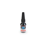 Park Tool TLR-2 high-strength threadlocker for steel, aluminum, and carbon fiber bike components in a workshop setting.