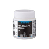 Shimano Workshop Seal Grease for Microspline freehub, high-quality bicycle hub lubricant, shown in a professional workshop setting.