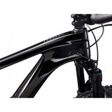 Giant Trance Advanced Pro 29 mountain bike with Shimano Deore XT disc brakes, black and green frame, rugged off-road tires.
