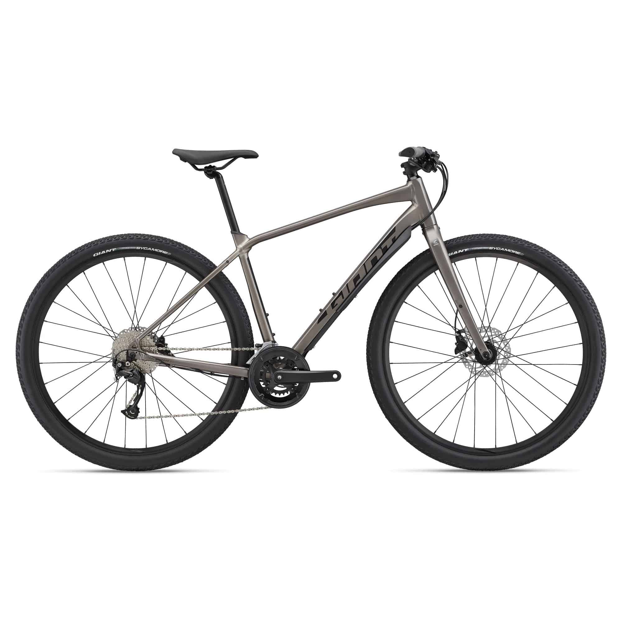 Giant ToughRoad SLR 2 gravel bike with Shimano Acera components and disc brakes, shown from a side angle on a scenic trail.