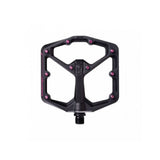 Crank Brothers Stamp 7 black and pink flat MTB pedal with adjustable pins, featuring a durable metal body and grip-enhancing design.