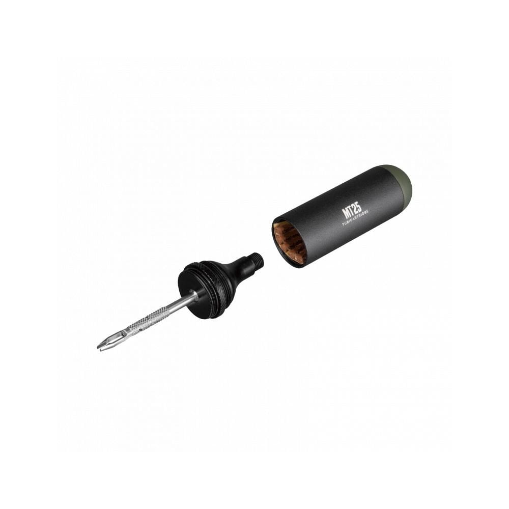 Topeak Tubi Cartridge MT25 black storage box for mountain bike tubeless tire repair components, mounted on bike frame.