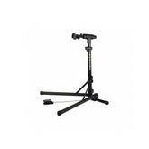 Topeak PrepStand EUP Pro foldable bike workstand holding a black e-bike, designed for heavy bikes and e-bikes in a workshop setting.