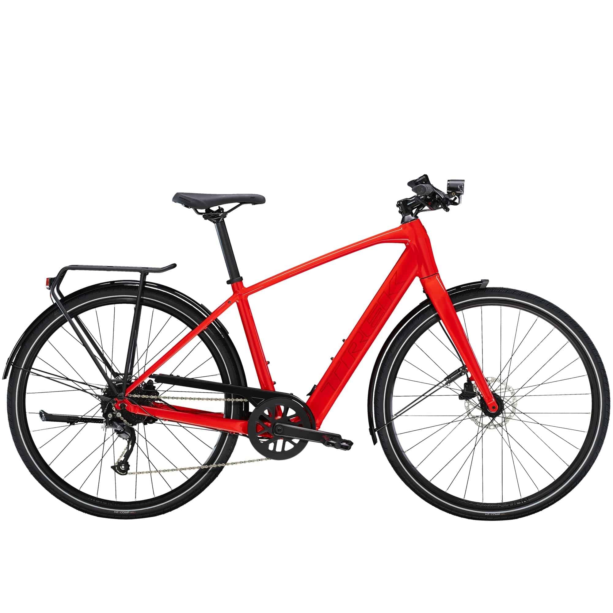 Trek FX+ 2 e-hybrid bike with HyDrive pedal assist, front lights, mudguards, and rear rack, ready for city commuting.