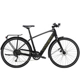 Trek FX+ 2 e-hybrid bike with HyDrive pedal assist, front lights, mudguards, and rear rack, ready for urban commuting.