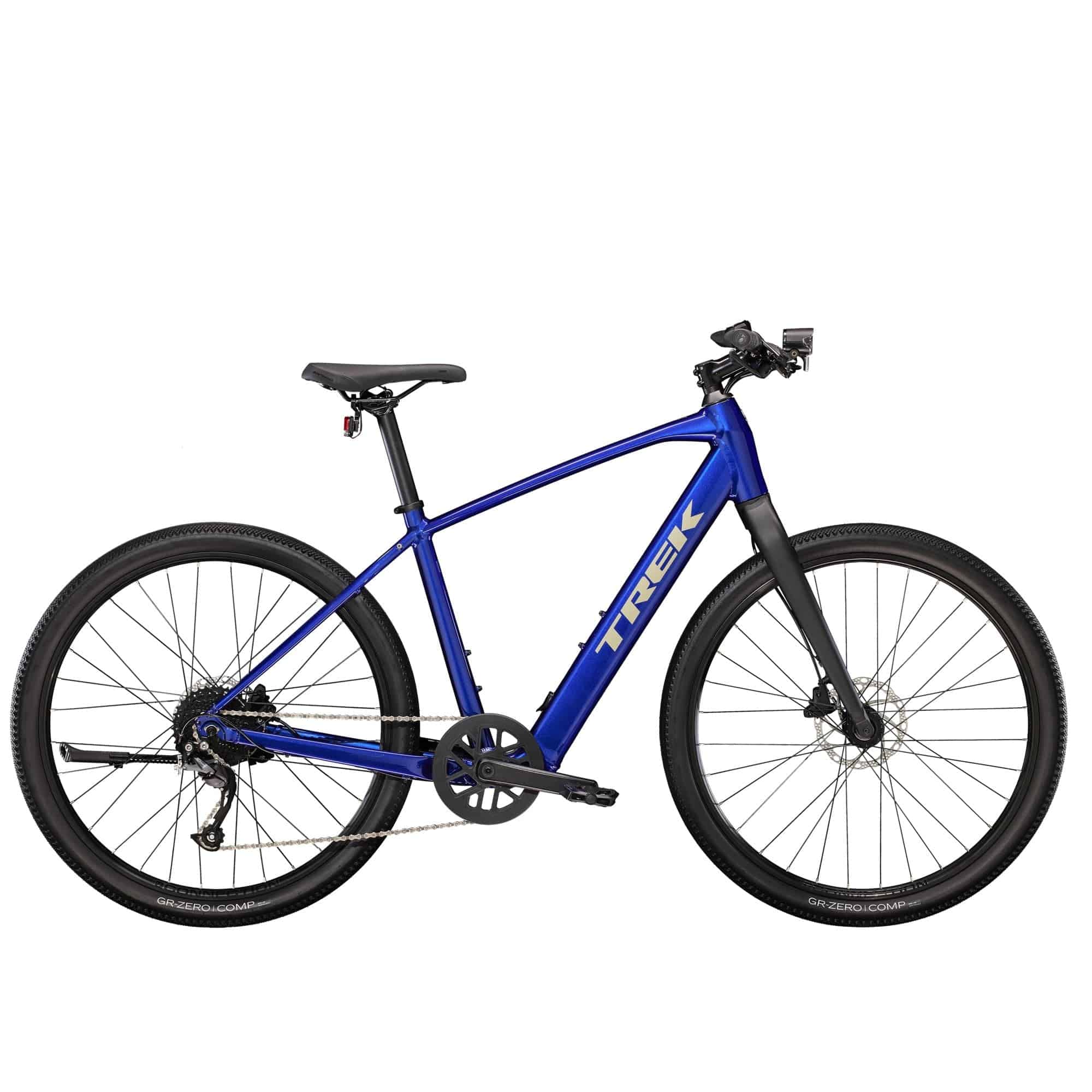Trek Dual Sport+ 2 e-hybrid bike with HyDrive pedal assist and versatile accessories, shown with a rider on a trail.
