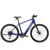 Trek Dual Sport+ 2 e-hybrid bike with HyDrive pedal assist and versatile accessories, ready for city or trail riding.
