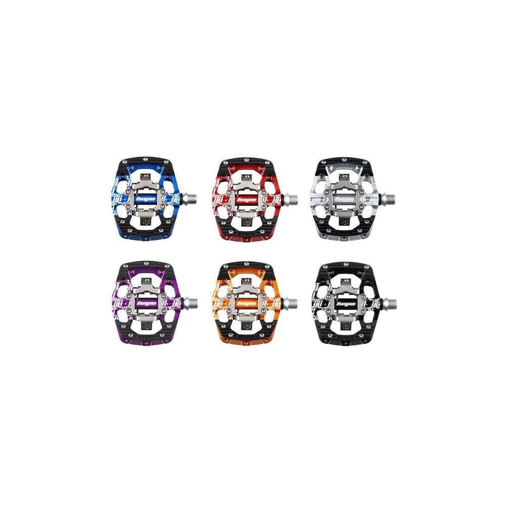 Hope Union gravity clipless cycling pedals pair, black components with metal cleats for secure bike pedal connection.