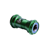 Wheels Manufacturing PF30 outboard bottom bracket with ABEC-3 bearings for 24mm cranks, featuring green outer shell.
