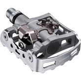 Shimano PD-M324 SPD MTB pedals with one-sided clipless and flat design, suitable for mountain biking components.