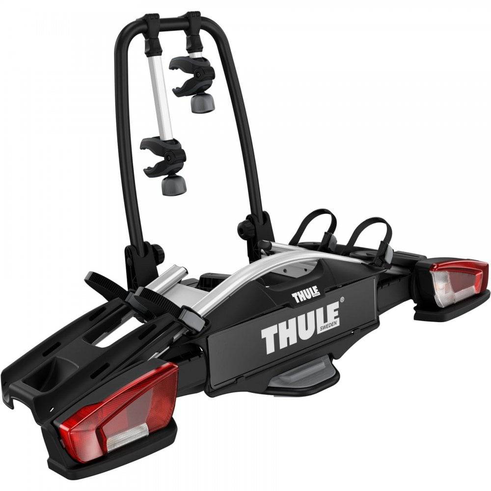 Thule VeloCompact 924021 2-bike towball carrier with 13-pin connector mounted on a vehicle for bike transport.