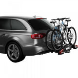 Thule VeloCompact 924021 2-bike towball carrier with 13-pin connector, mounted on vehicle for secure bike transport.