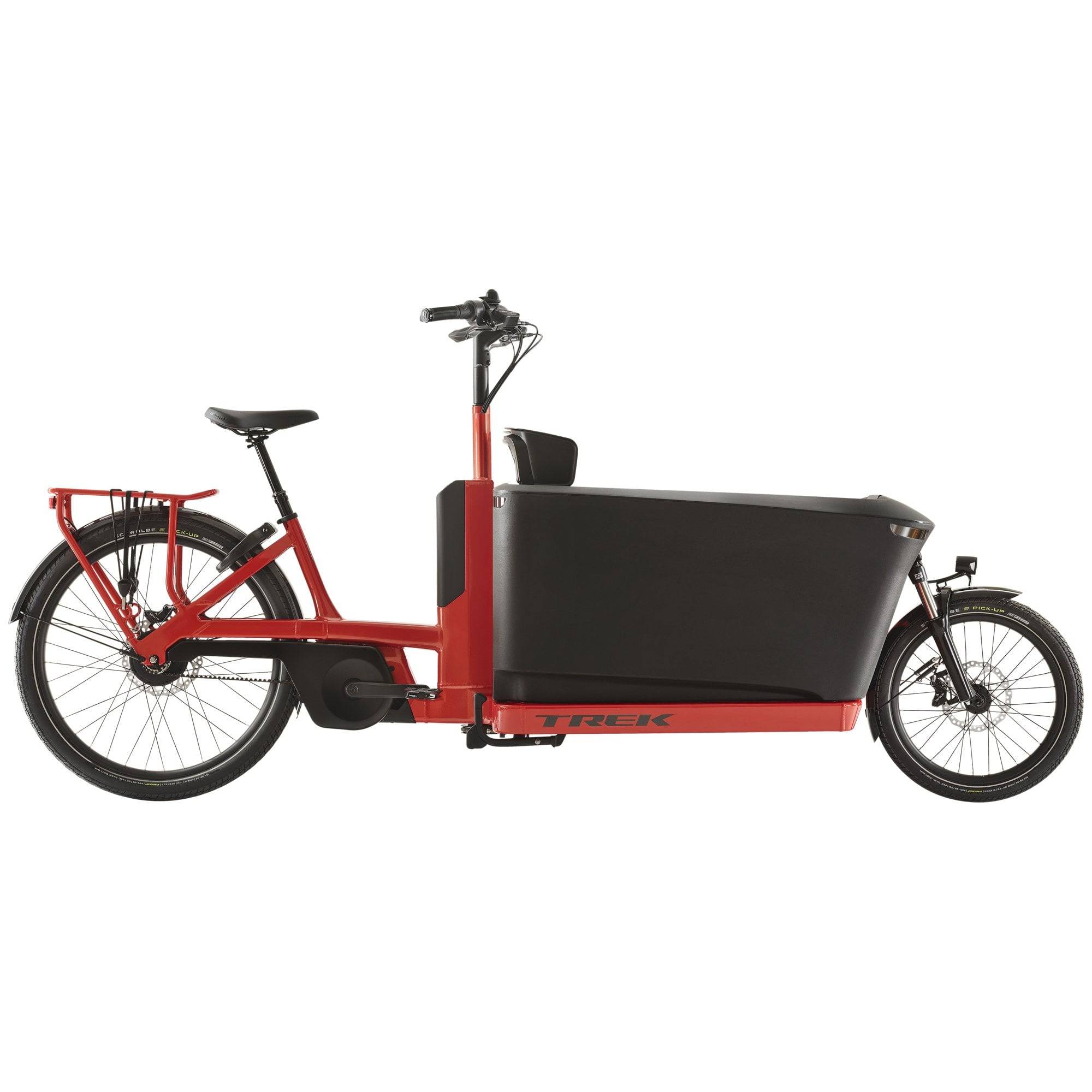 Trek Fetch+ 4 electric cargo bike with Bosch Performance Line CX motor and customizable child seating in a city setting.