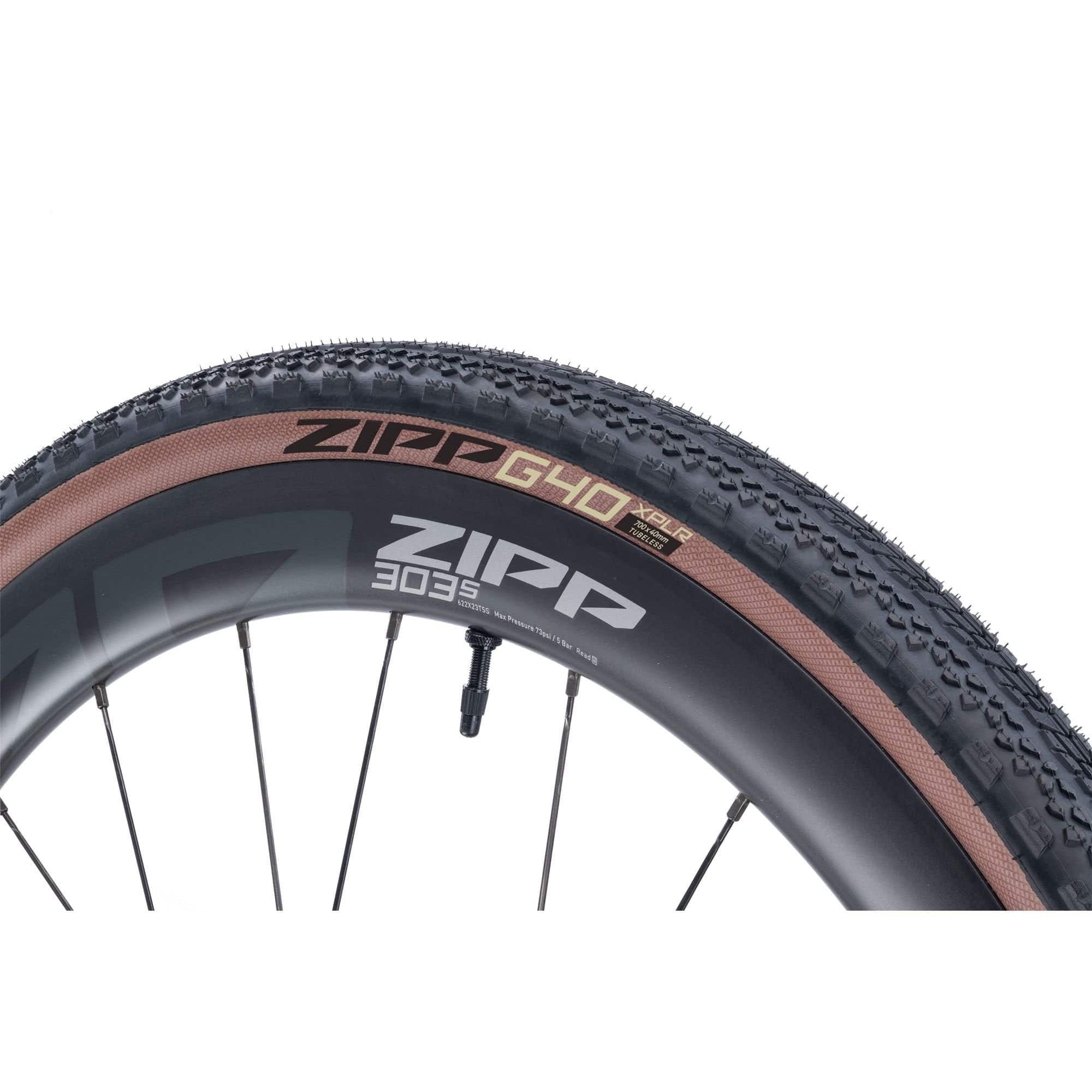 Zipp G40 XPLR 700x40C gravel clincher tire, tubeless ready and puncture resistant, mounted on a wheel rim.