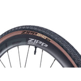 Zipp G40 XPLR 700x40C gravel clincher tire, tubeless ready and puncture resistant, mounted on a wheel rim.