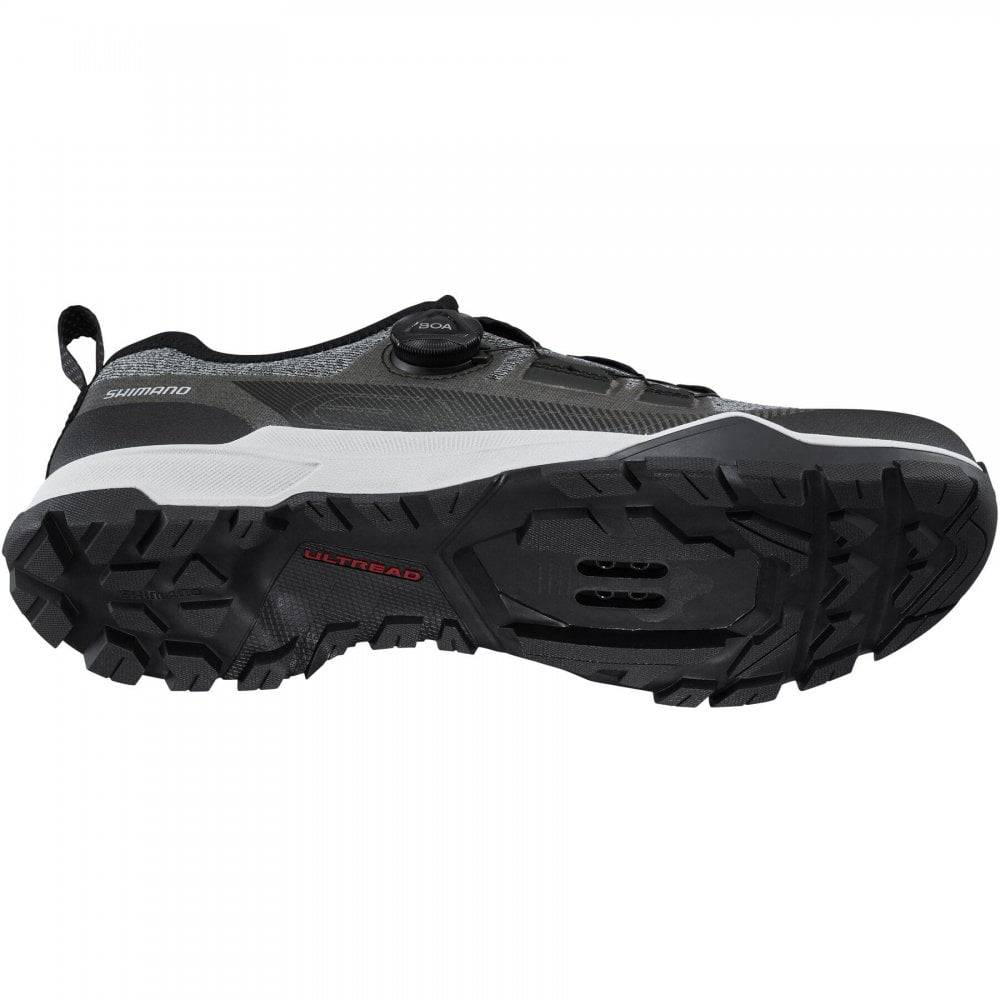 Shimano EX7 black MTB shoes featuring BOA L6 dial and ULTREAD EX outsole, designed for mountain biking performance.