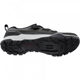 Shimano EX7 black MTB shoes featuring BOA L6 dial and ULTREAD EX outsole, designed for mountain biking performance.